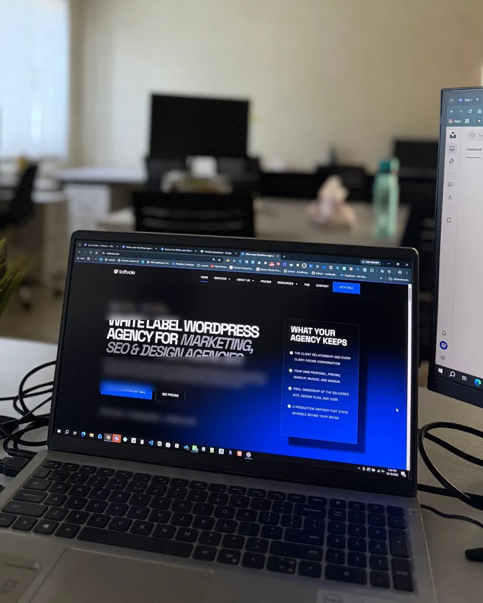 A Softvole workstation with the Softvole website open on a laptop
